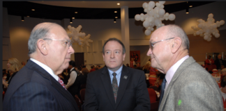 Trustees Robert Glaser (center) and Dave Wilson (right) speak with Chancellor Cesar Maldonado at a college event